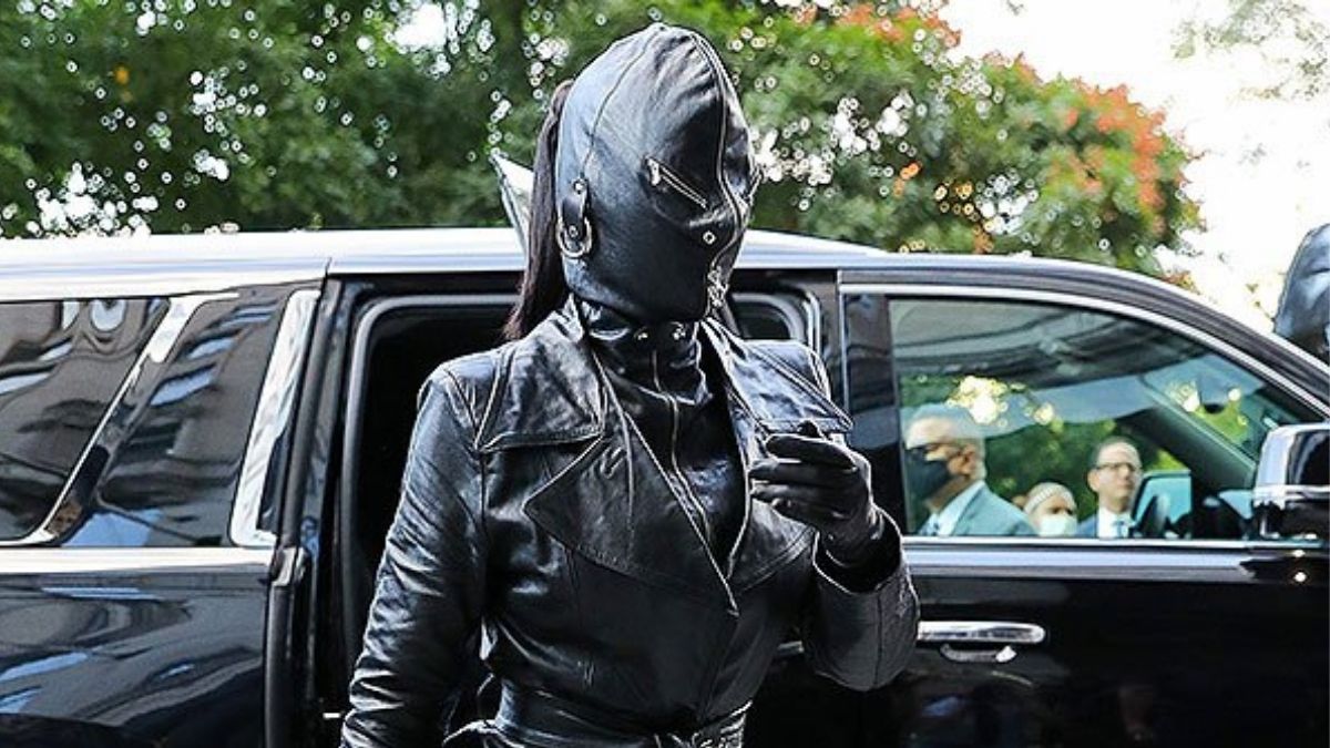 Kim Kardashian Arrives At New York City (NYC) Hotel Covering Her Face Completely In Bizarreall-leather Balenciaga Ensemble
